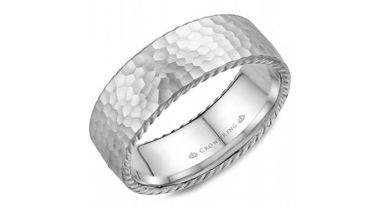 A hammered finish white gold men’s wedding band by CrownRing, available at Davidson & Licht.