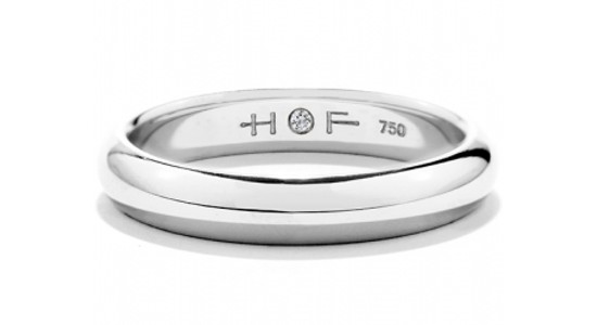 A polished men’s wedding band by Hearts On Fire, available at Davidson & Licht.