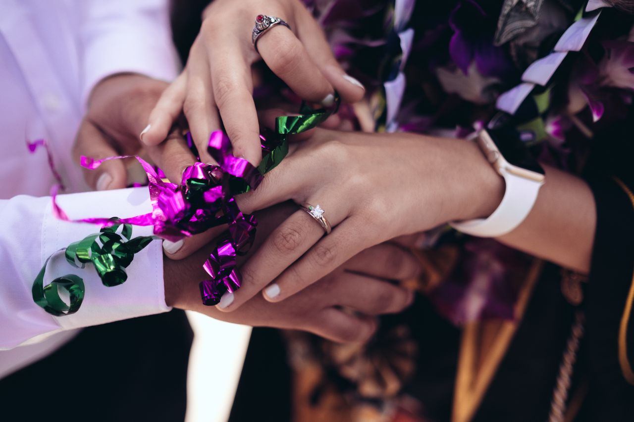 solitaire engagement ring on hand of graduation