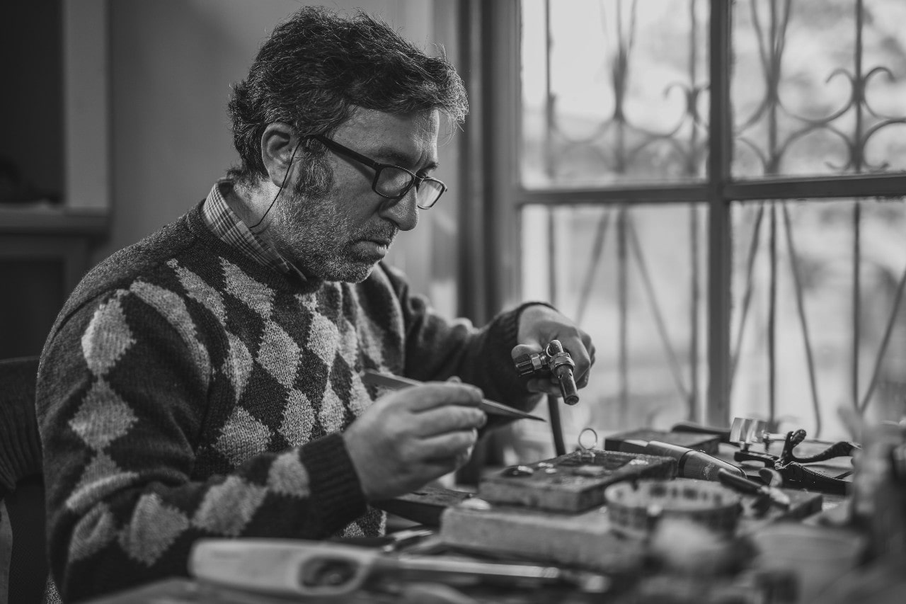 An expert craftsman designing a custom ring.