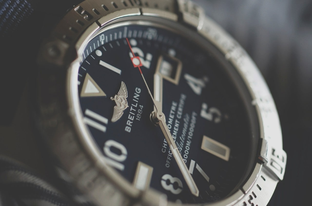 A close-up of the dial on a sporty yet elegant Breitling watch.